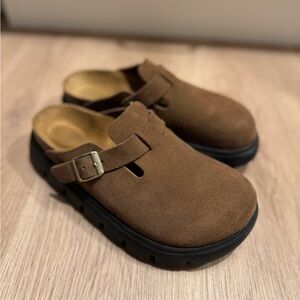 Brown Birkenstock Clogs.